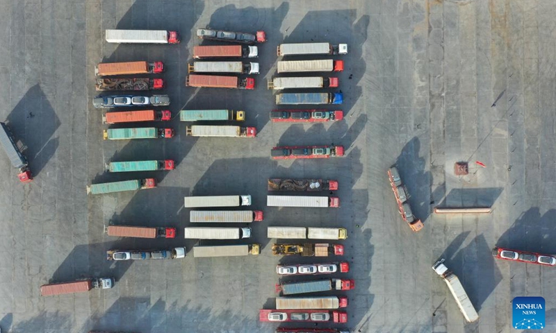 This aerial photo taken on Nov. 8, 2023 shows trucks parking at the Torugart port of northwest China's Xinjiang Uygur Autonomous Region.  (Photo: Xinhua)