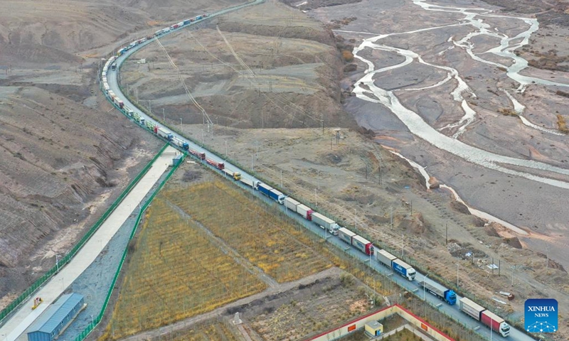 This aerial photo taken on Nov. 7, 2023 shows trucks entering the Irkeshtam port in northwest China's Xinjiang Uygur Autonomous Region.  (Photo: Xinhua)