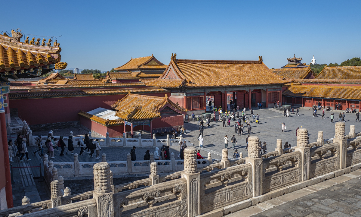 Tourists enjoy themselves at the Palace Museum in Beijing. Photo: VCG