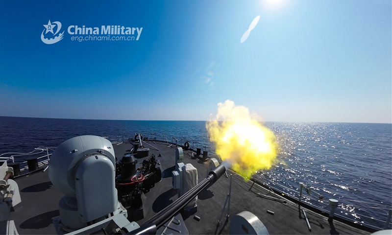 A minesweeper attached to a naval group under the PLA Northern Theater Command fires at mock targets at sea during a maritime combat training exercise on October 23, 2023. (Photo:eng.chinamil.com.cn)