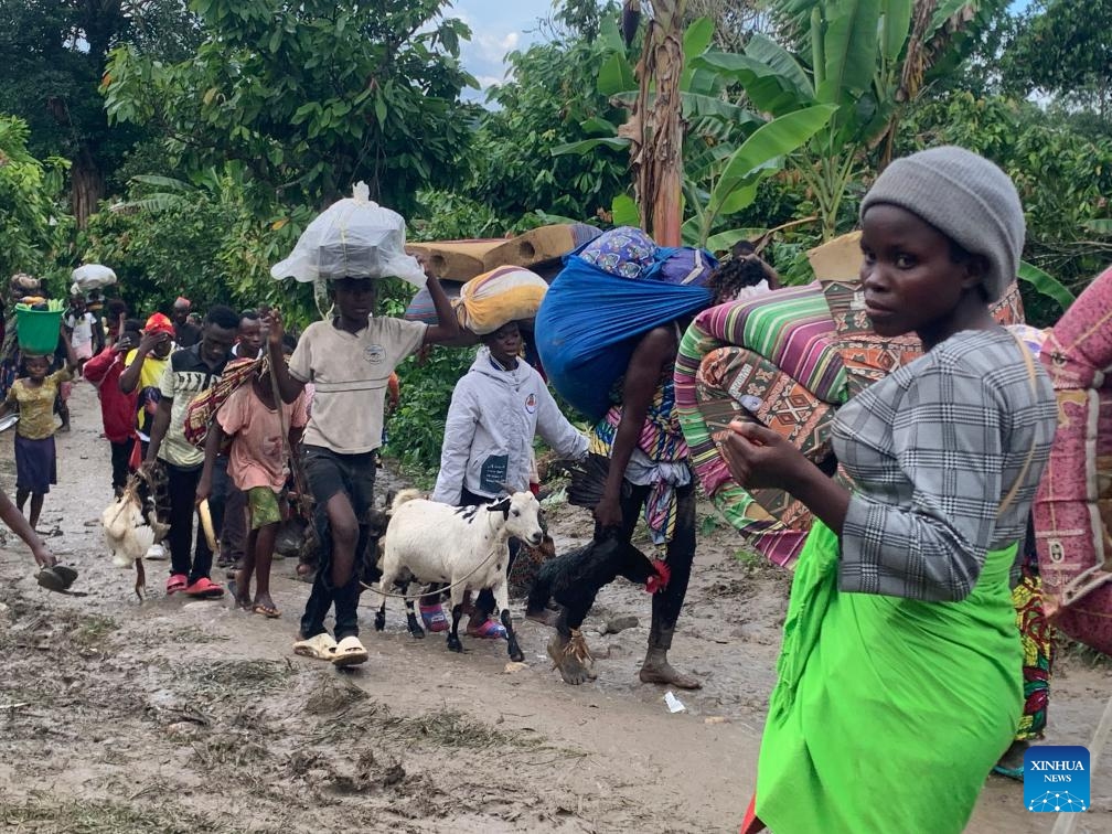 Congolese refugees are on their way to a holding center in the district of Bundibugyo, western Uganda, on Nov. 13, 2023. More than 1,000 refugees from the Democratic Republic of the Congo (DRC) have fled to Uganda following recent attacks by suspected Allied Democratic Forces (ADF) rebels, according to a local humanitarian organization. (Photo: Xinhua)