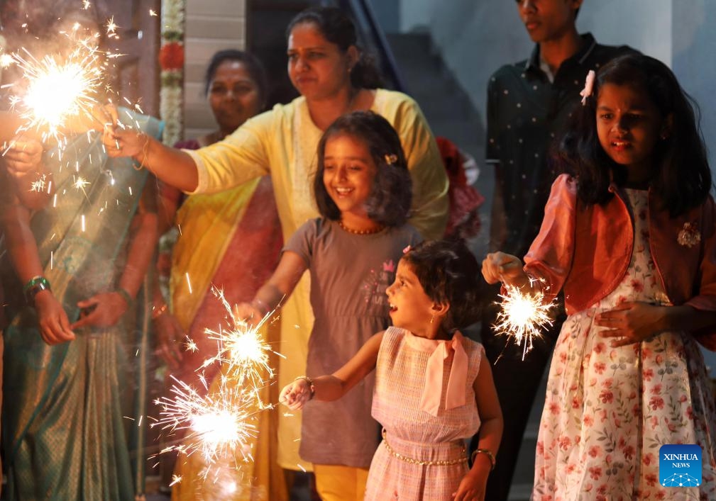 People play with firecrackers as they celebrate Diwali, or the Hindu festival of lights, in Bengaluru, India, Nov. 13, 2023.(Photo: Xinhua)