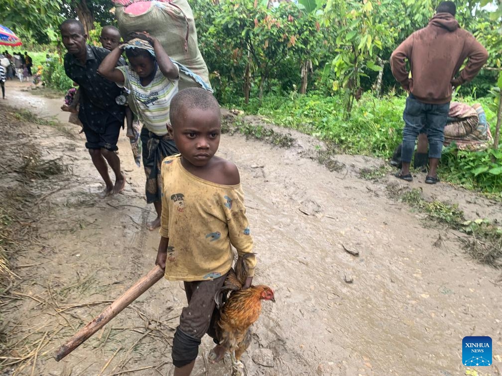 Congolese refugees are on their way to a holding center in the district of Bundibugyo, western Uganda, on Nov. 13, 2023. More than 1,000 refugees from the Democratic Republic of the Congo (DRC) have fled to Uganda following recent attacks by suspected Allied Democratic Forces (ADF) rebels, according to a local humanitarian organization. (Photo: Xinhua)