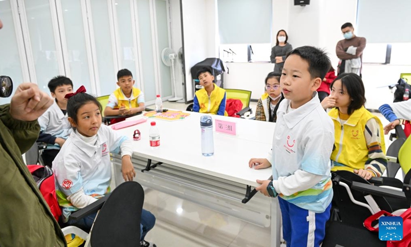 Members of a children's deliberation organization are engaged in a discussion on child-friendly measures and behaviors at the women's and children's activity center of Luohu District in Shenzhen, south China's Guangdong Province, Nov. 18, 2023. Shenzhen launched China's first guidelines for building a child-friendly city eight years ago. Since then the city has been rolling out a spate of measures spearheading the construction towards this aim. (Photo: Xinhua)