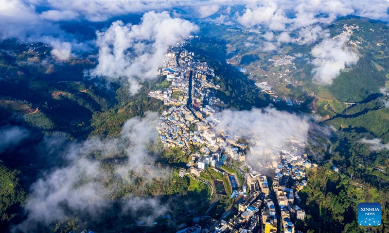 This aerial photo taken on Nov. 19, 2023 shows a view of Luchun County of Honghe Hani and Yi Autonomous Prefecture, southwest China's Yunnan Province. The long street banquet, a time-honoured tradition of Hani ethnic group in China, was held here during a cultural tourism festival on Sunday.  (Photo: Xinhua)