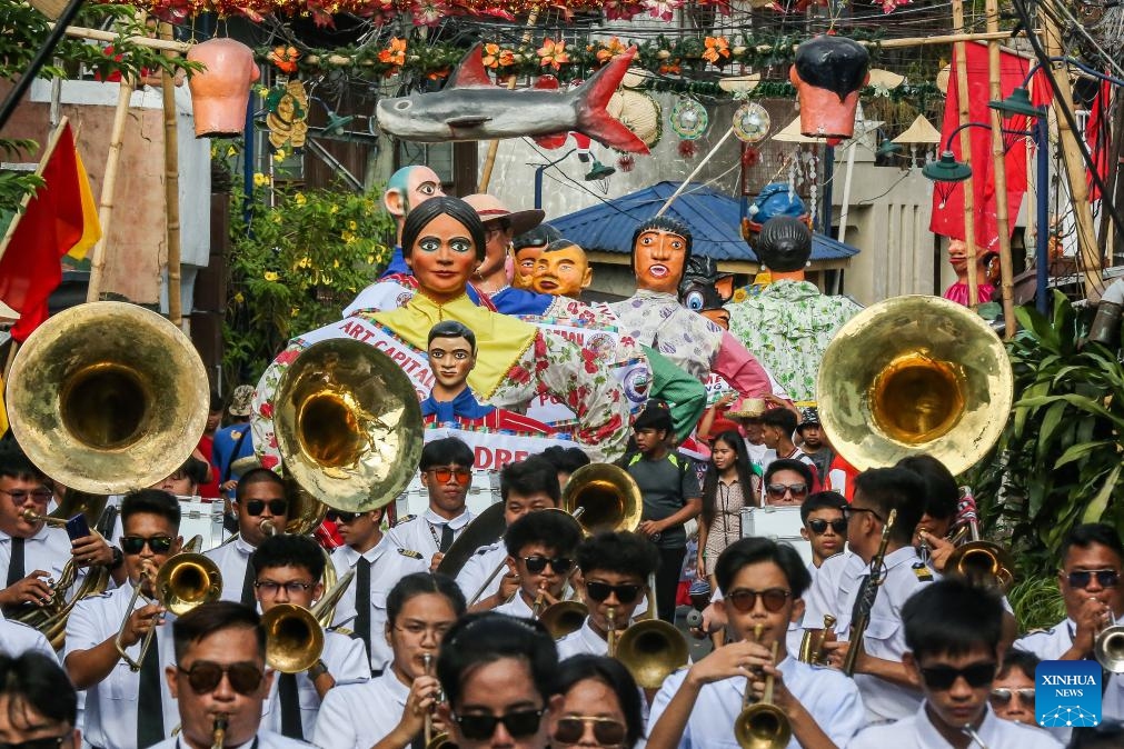 Large papier-mache puppets dressed in colorful costumes are paraded along a street during the Higantes (giants) Festival in Rizal Province, the Philippines on Nov. 22, 2023.(Photo: Xinhua)