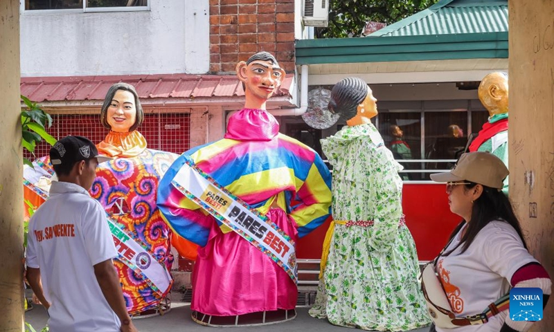 Large papier-mache puppets dressed in colorful costumes are paraded along a street during the Higantes (giants) Festival in Rizal Province, the Philippines on Nov. 22, 2023.(Photo: Xinhua)