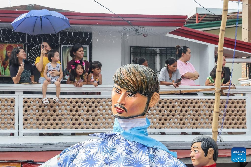 Large papier-mache puppets dressed in colorful costumes are paraded along a street during the Higantes (giants) Festival in Rizal Province, the Philippines on Nov. 22, 2023.(Photo: Xinhua)