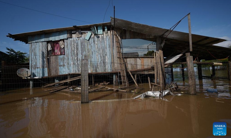 This photo shows a house in flooded area in Canoas, Rio Grande do Sul, Brazil, Nov. 24, 2023.(Photo: Xinhua)