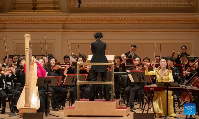 Artists from the Central Conservatory of Music Symphony Orchestra of Beijing, China perform at Carnegie Hall in New York, the United States on Nov. 24, 2023. Artists from the leading Chinese symphony orchestra returned here on Friday night after a COVID-induced hiatus and won the hearts of over a thousand audience members with their world premiere compositions.(Photo: Xinhua)