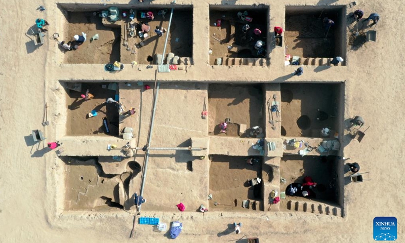 This aerial photo taken on Oct. 25, 2023 shows archaeologists working during the fourth excavation of the Bairen Town site in the city of Xingtai, north China's Hebei Province.  (Photo: Xinhua)