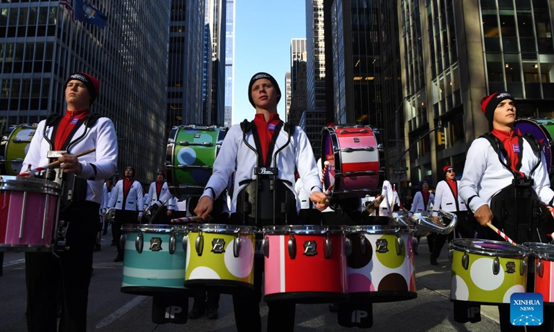 A band marches during the 2023 Macy's Thanksgiving Day Parade in New York, the United States, on Nov. 23, 2023. (Photo: Xinhua)