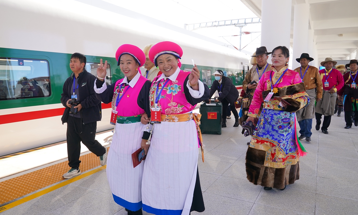 Passengers enter the railway station in Shangri-La, Southwest China's Yunnan Province to board a train on November 26, 2023, as the Lijiang-Shangri-La Railway officially opens for operation. Photo: VCG
