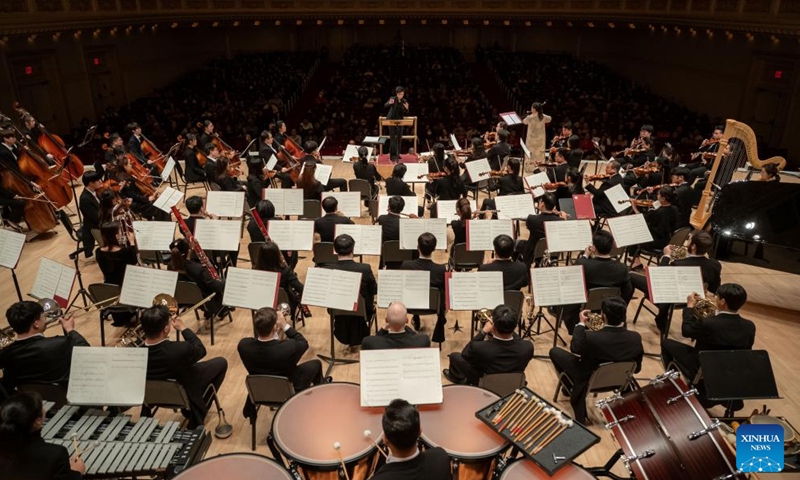 Artists from the Central Conservatory of Music Symphony Orchestra of Beijing, China perform at Carnegie Hall in New York, the United States on Nov. 24, 2023. Artists from the leading Chinese symphony orchestra returned here on Friday night after a COVID-induced hiatus and won the hearts of over a thousand audience members with their world premiere compositions. (Photo: Xinhua)