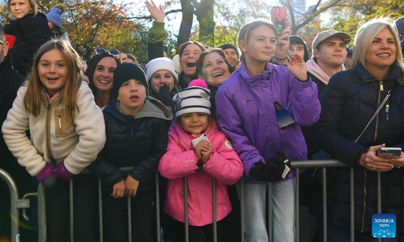 People watch the 2023 Macy's Thanksgiving Day Parade in New York, the United States, on Nov. 23, 2023. (Photo: Xinhua)