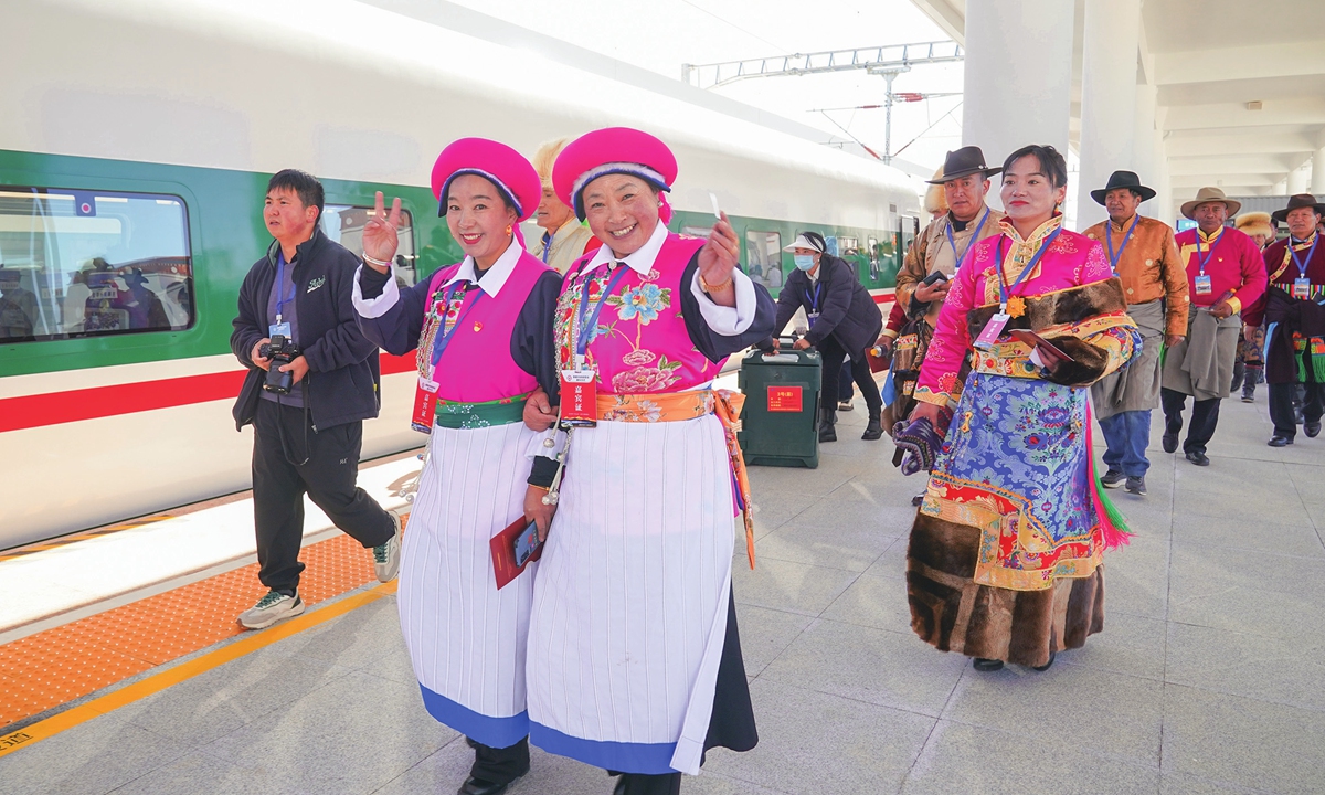 Passengers enter the railway station in Shangri-La, Southwest China's Yunnan Province to board a train on November 26, 2023, as the Lijiang-Shangri-La railway officially opens for operation. Photo: VCG