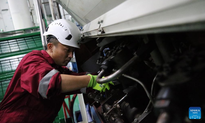 Chief Machinist Tang Jianguo checks equipment aboard China's research icebreaker Xuelong 2, on Nov. 26, 2023. Currently on an Antarctic expedition, the icebreaker, otherwise known as Snow Dragon 2, is ploughing through the belt of prevailing westerlies, nicknamed the rolling forties, with its companion cargo vessel Tian Hui. (Photo: Xinhua)