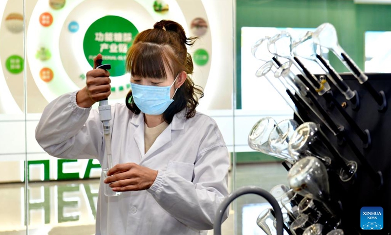 An employee conducts a test at a biotech company in Boxing County, east China's Shandong Province, Nov. 26, 2023. (Photo: Xinhua)