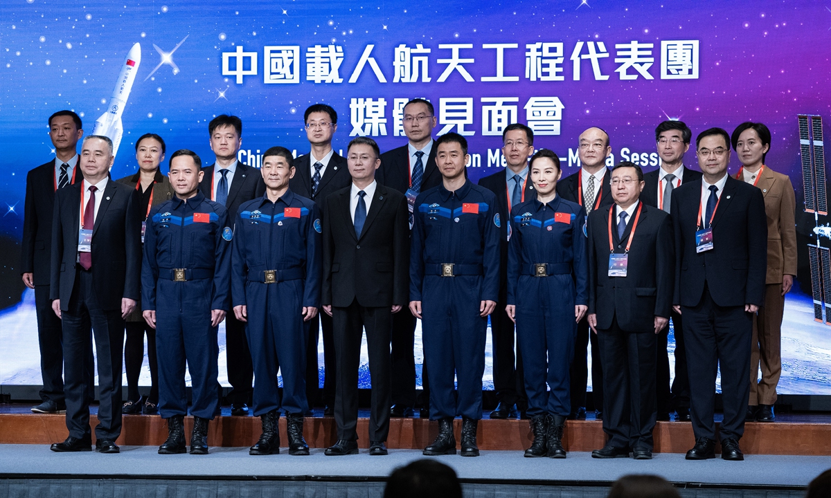 A delegation of China's manned space engineering pose for a group photo at Hong Kong Convention and Exhibition Centre. The delegation will pay a six-day visit to Hong Kong and Macao special administrative regions from November 28 through December 3, 2023. Photo: VCG