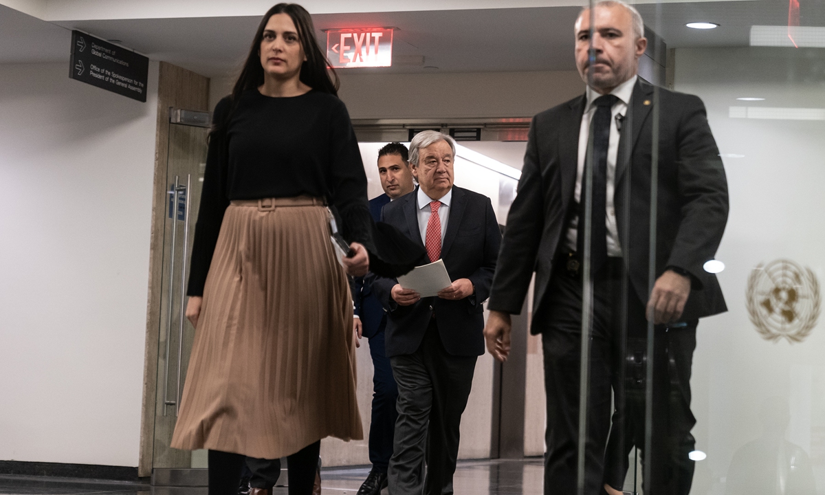 UN Secretary-General Antonio Guterres (center) arrives for a press briefing at the UN Headquarters in New York on November 27, 2023 to answer questions on the Palestine-Israel conflict, among others. On the two-day extension of the Qatar-brokered cease-fire, Guterres said that it was 