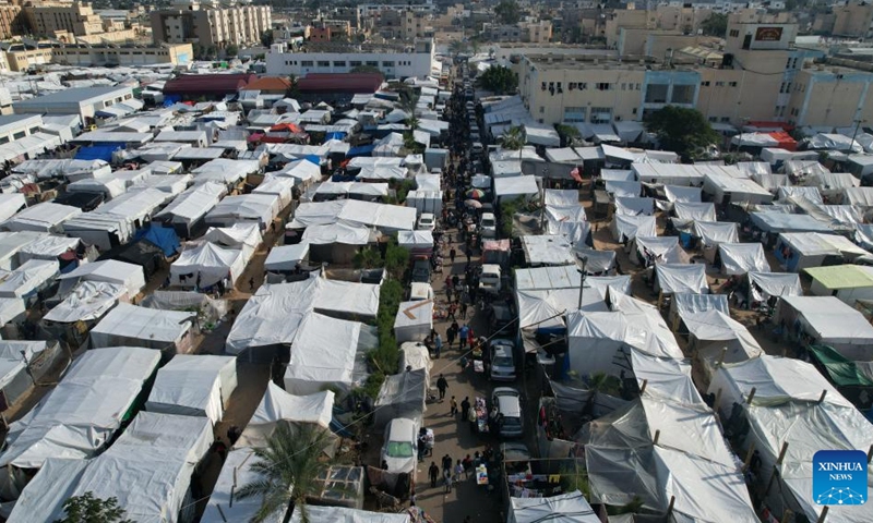 This aerial photo taken on Nov. 28, 2023 shows a temporary refugee camp in the southern Gaza Strip city of Khan Younis. At least 1.7 million people have been displaced in the Gaza Strip, the UN Office for the Coordination of Humanitarian Affairs (OCHA) has warned in a recent statement.(Photo: Xinhua)