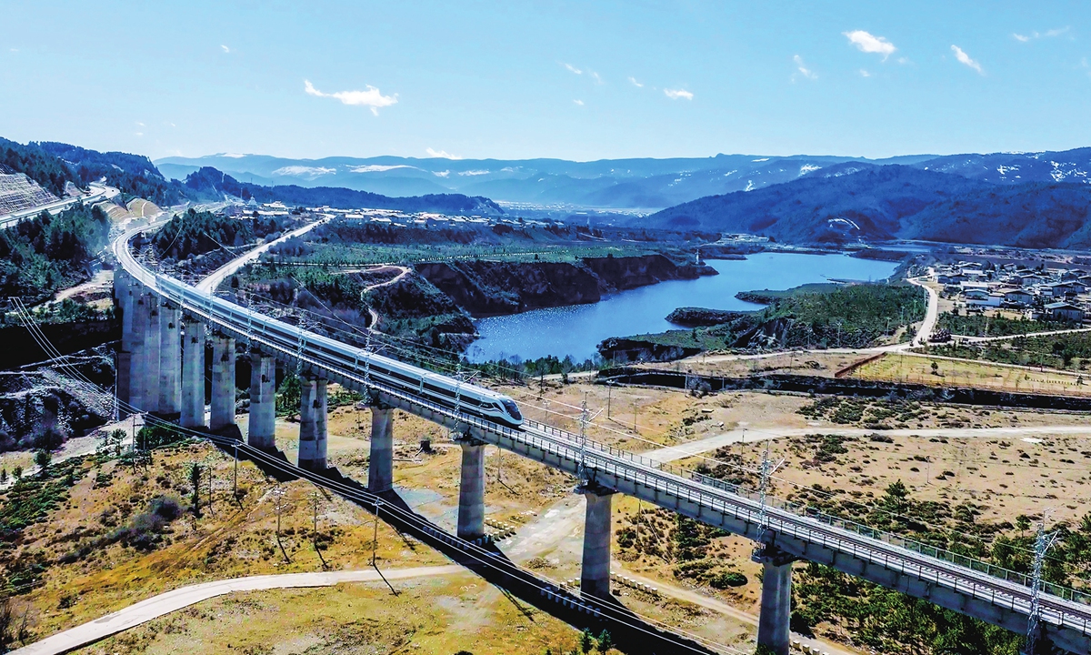 A high-speed train runs on the Lijiang-Shangri-La railway. Photo: VCG