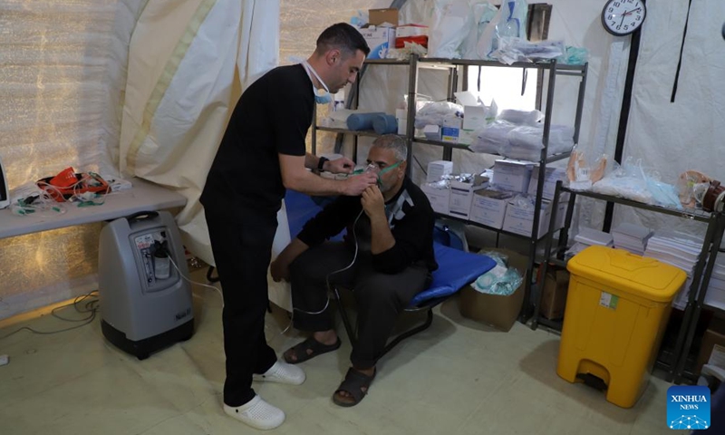 An injured person receives treatment at a temporary hospital in the southern Gaza Strip city of Khan Younis Dec. 2, 2023. (Photo: Xinhua)