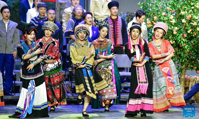 Artists perform in an opera based on the story of Huang Wenxiu, a village official who died in 2019 on the frontline of China's war against poverty, at Guiyang Grand Theatre in Guiyang, southwest China's Guizhou Province, Nov. 30, 2023. (Photo: Xinhua)