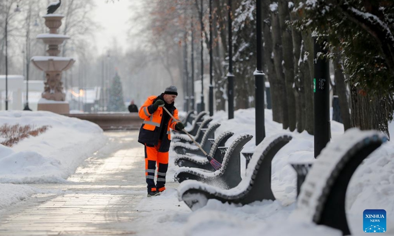 A sanitation worker clears snow at a park in Moscow, Russia, Dec. 2, 2023. (Photo: Xinhua)