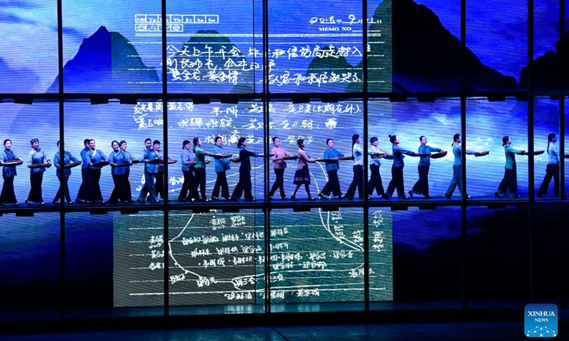 Artists perform in an opera based on the story of Huang Wenxiu, a village official who died in 2019 on the frontline of China's war against poverty, at Guiyang Grand Theatre in Guiyang, southwest China's Guizhou Province, Nov. 30, 2023. (Photo: Xinhua)