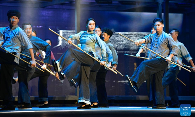 Artists perform in an opera based on the story of Huang Wenxiu, a village official who died in 2019 on the frontline of China's war against poverty, at Guiyang Grand Theatre in Guiyang, southwest China's Guizhou Province, Nov. 30, 2023. (Photo: Xinhua)