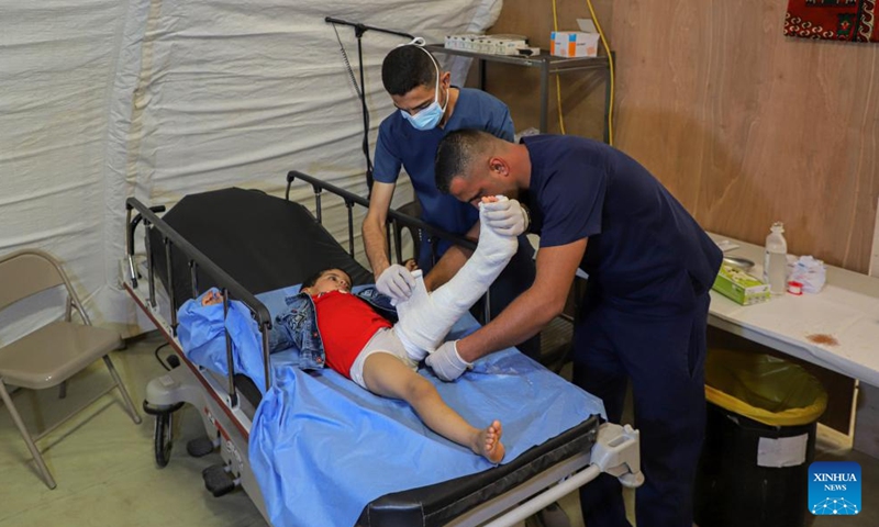 An injured child receives treatment at a temporary hospital in the southern Gaza Strip city of Khan Younis Dec. 2, 2023. (Photo: Xinhua)