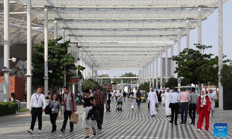 Visitors walk at the Green Zone of the 28th session of the Conference of the Parties to the United Nations Framework Convention on Climate Change (COP28), in Dubai, the United Arab Emirates, Dec. 3, 2023. Green Zone of COP28 opens to the public at the Expo City of Dubai on Sunday. (Photo: Xinhua)