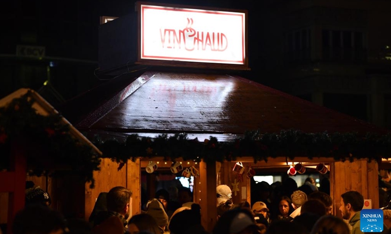 People visit the lakeside Christmas market in Montreux, Switzerland, Dec. 2, 2023. The lakeside Christmas market in Montreux is one of the most famous of its kind in the country. (Photo: Xinhua)