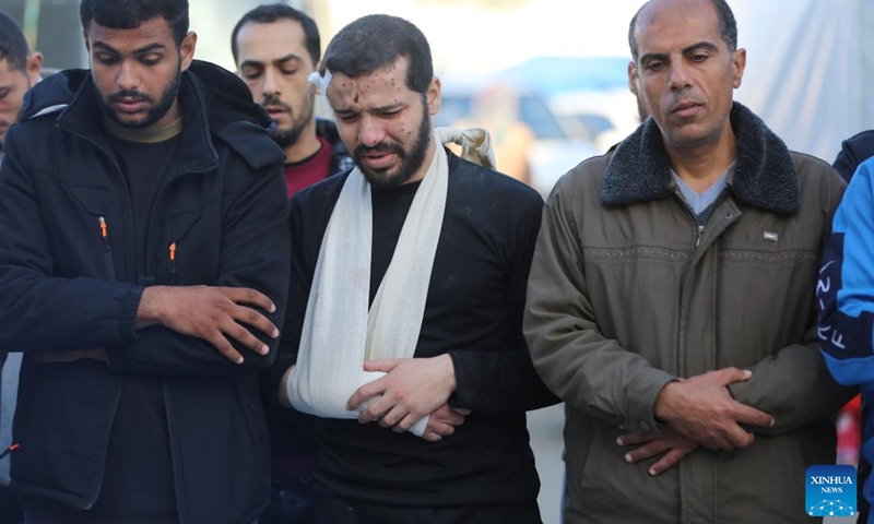 People mourn for victims killed in airstrikes in central Gaza Strip city of Deir el-Balah, Dec. 3, 2023. (Photo: Xinhua)