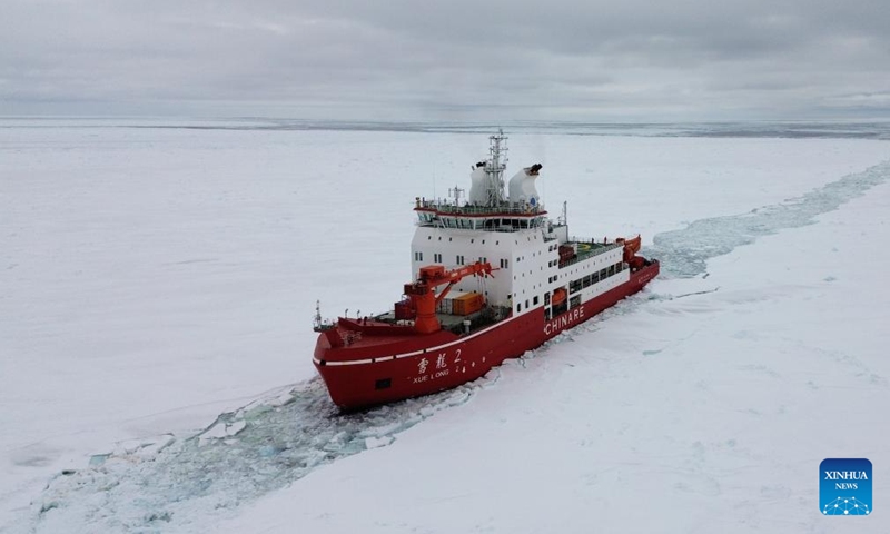 This aerial photo taken on Dec. 3, 2023 shows China's research icebreaker Xuelong 2 breaking ice and ploughing a waterway. China's research icebreaker Xuelong 2 and its companion cargo vessel Tian Hui are now sailing through ice floes. (Photo: Xinhua)