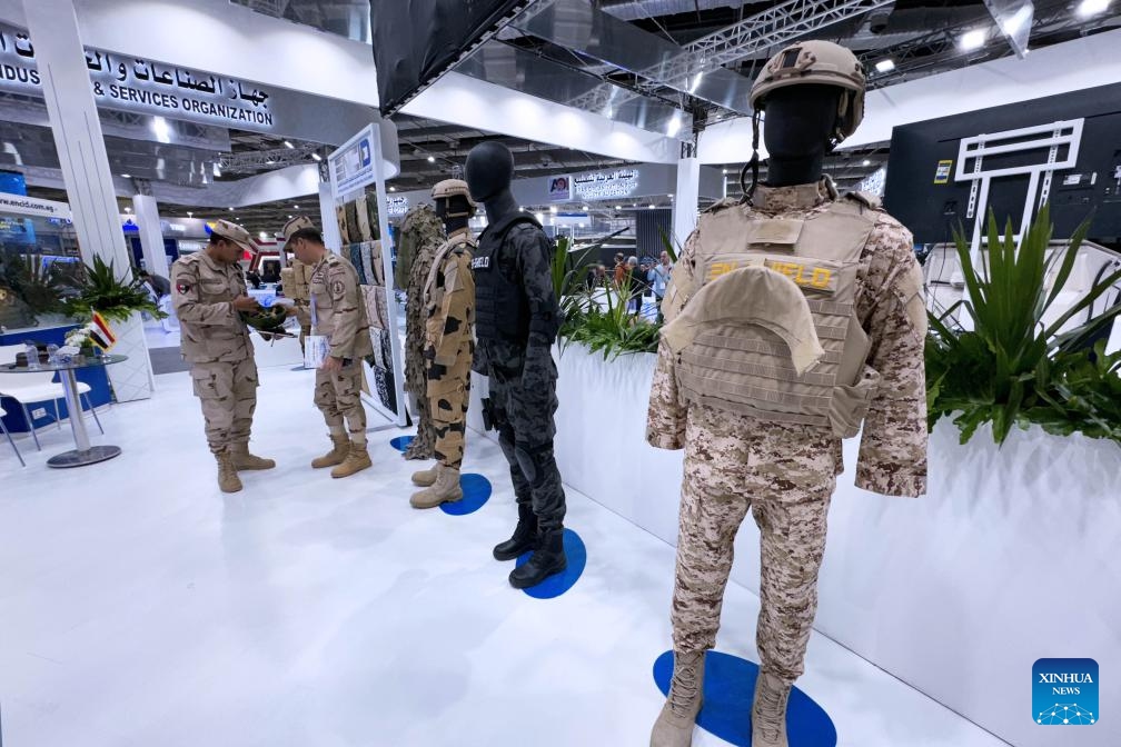 Military uniforms are exhibited at EDEX 2023 in Cairo, Egypt, on Dec. 4, 2023. Egypt held on Monday the third session of its international defense expo, EDEX 2023, in Cairo. The four-day biennial event features around 400 defense and security companies from several countries displaying their up-to-date military technology, equipment and systems across land, sea and air.(Photo: Xinhua)