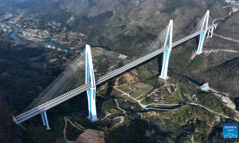 This aerial photo taken on Dec. 6, 2023 shows the Pingtang grand bridge in Pingtang County, southwest China's Guizhou Province. Due to the large number of bridges, their types, and the complex technologies used in the construction of the bridges, Guizhou is known as the museum of world bridges. For years, the province has developed tourism drawing upon these bridges to boost economic growth.(Photo: Xinhua)