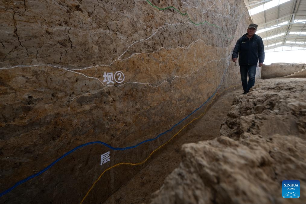 Archeologists work at the relics site of the Xiongjialing Dam in Jingmen, central China's Hubei Province, Dec. 4, 2023. The Xiongjialing Dam, which was initially built around 5,100 years ago, is part of the Qujialing relics site in the city of Jingmen, central China's Hubei Province. The dam, complete with a reservoir and spillway, has been identified as China's earliest known water conservancy project.(Photo: Xinhua)