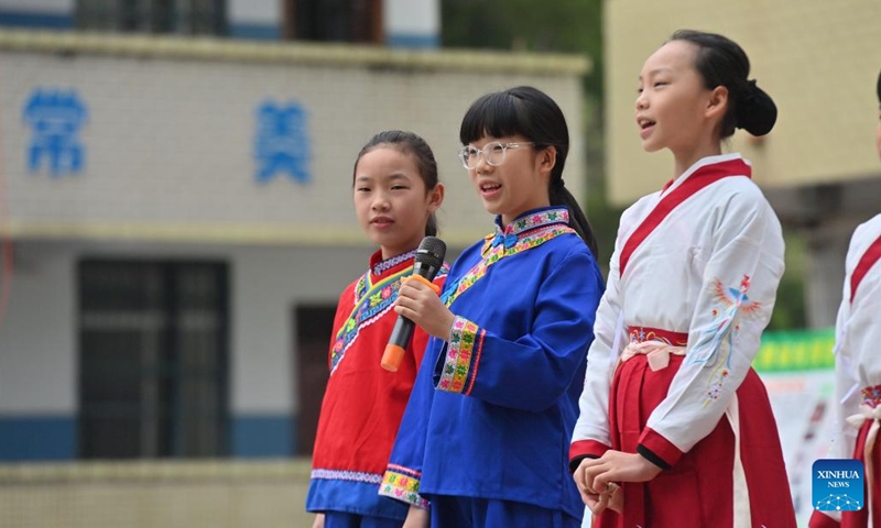 Students sing a Danjia song at a school in Mengjiang Town of Tengxian County of Wuzhou, south China's Guangxi Zhuang Autonomous Region, Dec. 6, 2023. In recent years, Mengjiang Town has been making various efforts in educating local students on the culture of Danjia, which refers to a group of people who have lived off the sea for generations, folk singing and dancing as well as calligraphy and painting.(Photo: Xinhua)