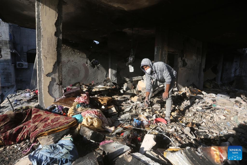 A man is seen among the rubble of a building destroyed in an Israeli strike in the southern Gaza Strip city of Rafah, on Dec. 7, 2023. Since Oct. 7, Israel has been launching a large-scale attack against Hamas in Gaza under the name Iron Swords, which has left 17,177 Palestinians dead, and more than 46,000 injured, said the Gaza-based Health Ministry on Thursday.(Photo: Xinhua)