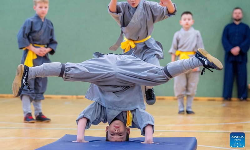 A participant performs at the Chinese Wushu (Kung Fu) and Tai Chi Performance Competition held by Lithuanian Wushu Federation in Vilnius, Lithuania, Dec. 9, 2023. (Photo: Xinhua)