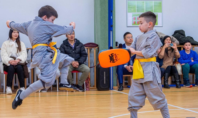 Participants perform at the Chinese Wushu (Kung Fu) and Tai Chi Performance Competition held by Lithuanian Wushu Federation in Vilnius, Lithuania, Dec. 9, 2023. (Photo: Xinhua)