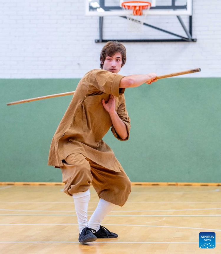 A participant performs at the Chinese Wushu (Kung Fu) and Tai Chi Performance Competition held by Lithuanian Wushu Federation in Vilnius, Lithuania, Dec. 9, 2023. (Photo: Xinhua)