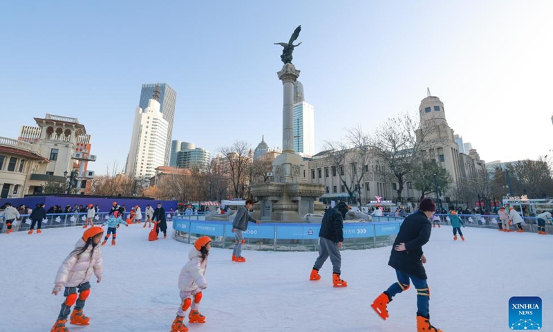 People skate at an ice rink in a public square of the Italian Style Area in Tianjin, north China, Dec. 9, 2023. (Photo: Xinhua)