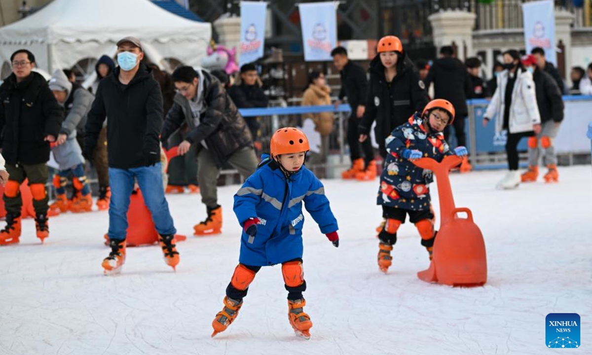 People have fun at an ice rink in a public square of the Italian Style Area in Tianjin, north China, Dec. 9, 2023. (Photo: Xinhua)