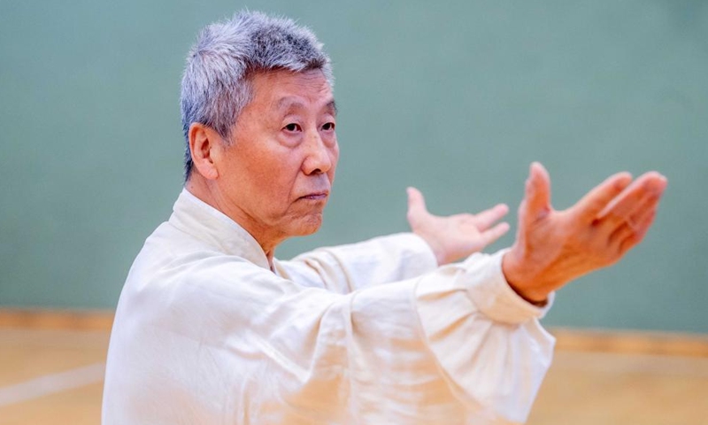 Wang Xiyin, the honorary president of the Lithuanian Taijiquan Association, performs at the Chinese Wushu (Kung Fu) and Tai Chi Performance Competition held by Lithuanian Wushu Federation in Vilnius, Lithuania, Dec. 9, 2023. (Photo: Xinhua)