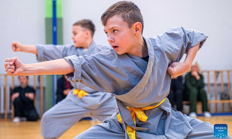 Participants perform at the Chinese Wushu (Kung Fu) and Tai Chi Performance Competition held by Lithuanian Wushu Federation in Vilnius, Lithuania, Dec. 9, 2023. (Photo: Xinhua)