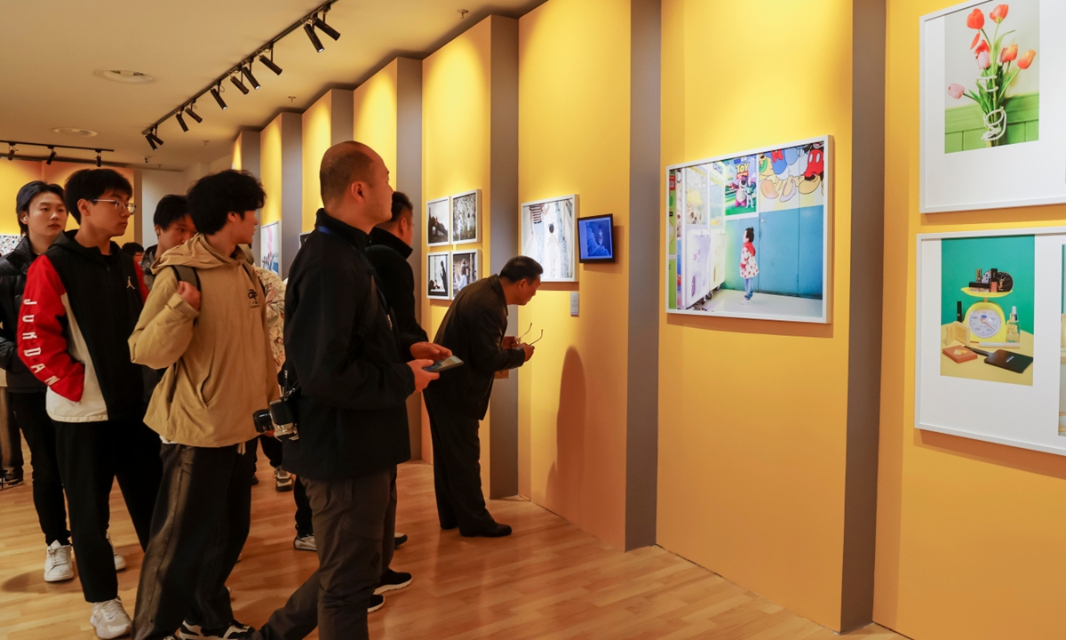 Visitors explore the exhibition in Suzhou, Jiangsu Province. Photo: Courtesy of Cao Yulei