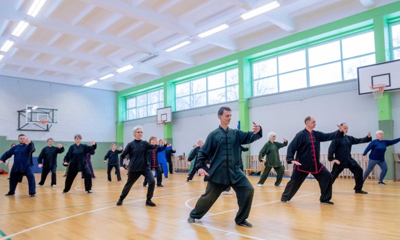 Participants perform at the Chinese Wushu (Kung Fu) and Tai Chi Performance Competition held by Lithuanian Wushu Federation in Vilnius, Lithuania, Dec. 9, 2023. (Photo: Xinhua)